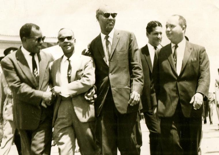 Dr Eric Williams, second from left, with members of his cabinet and supporters we Massa’s big children